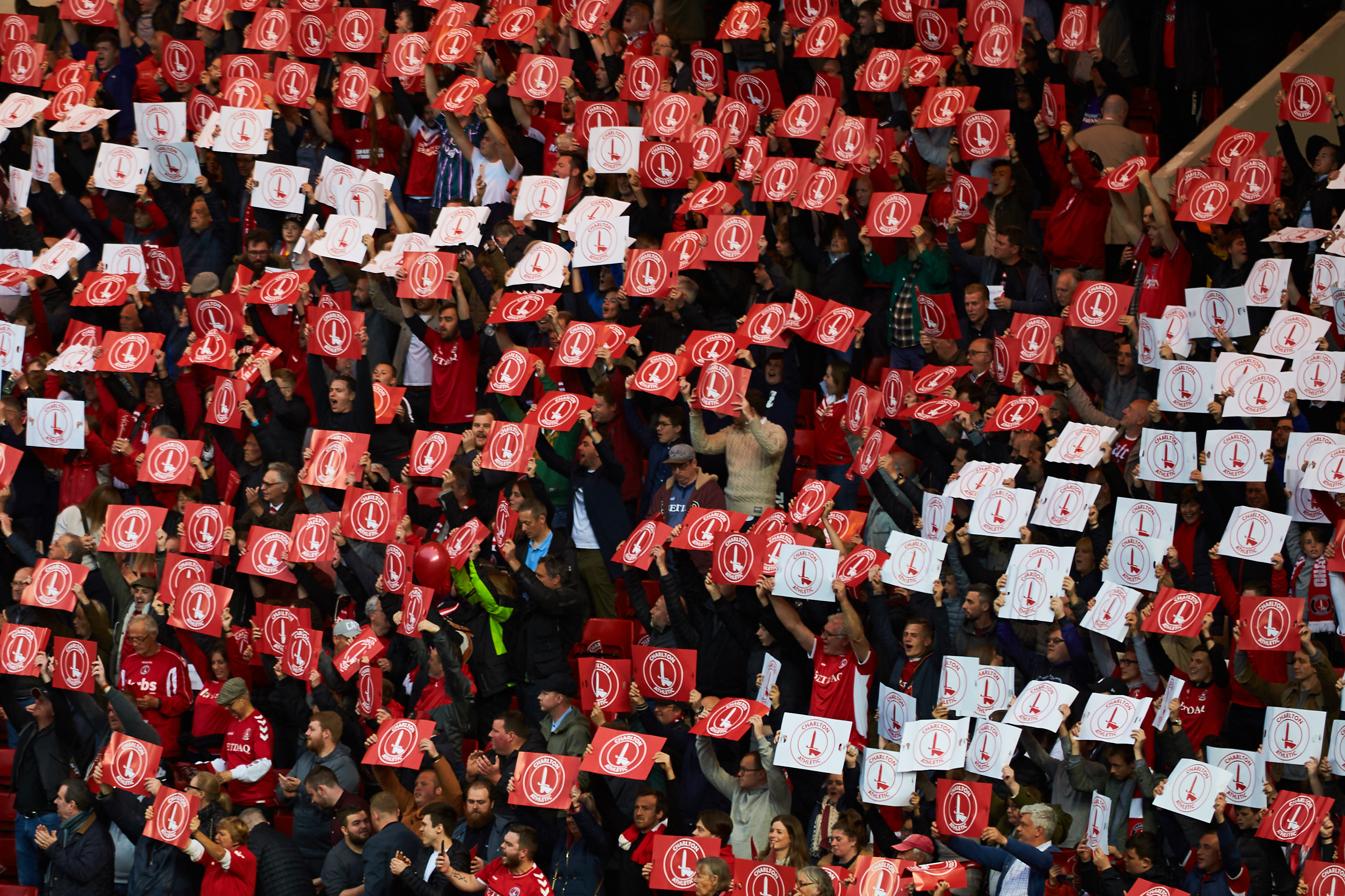 Addicks fans hold up Charlton badges ahead of the play-off final against Doncaster Rovers at The Valley in May 2019