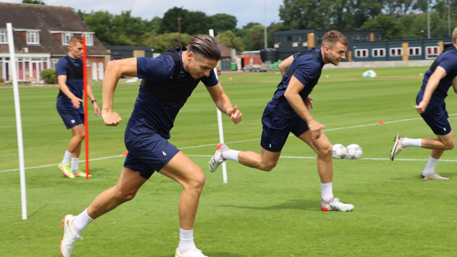 George Dobson and Sam Lavelle perform short sprints during pre-season training