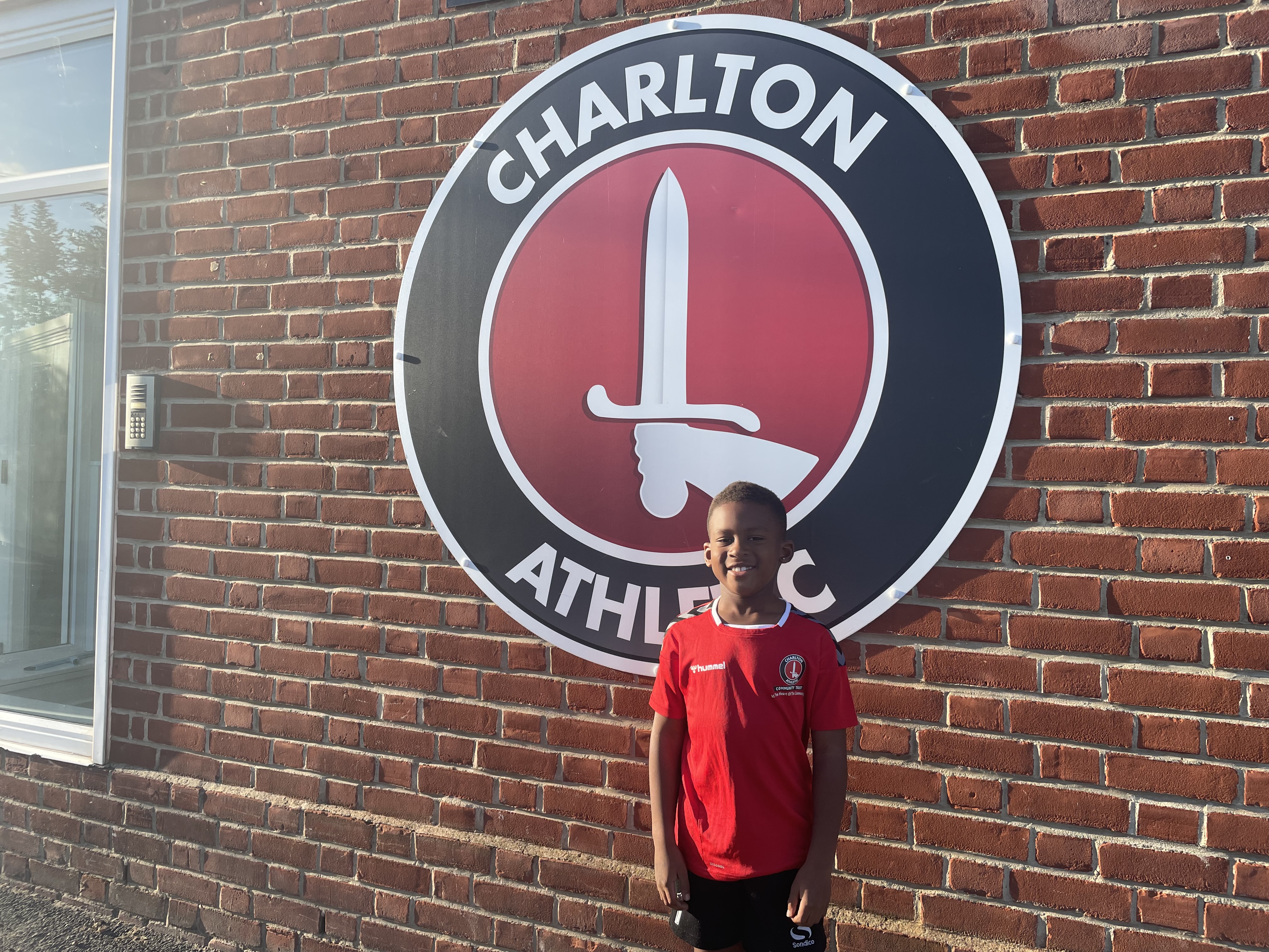 Niall in front of Charlton Athletic badge