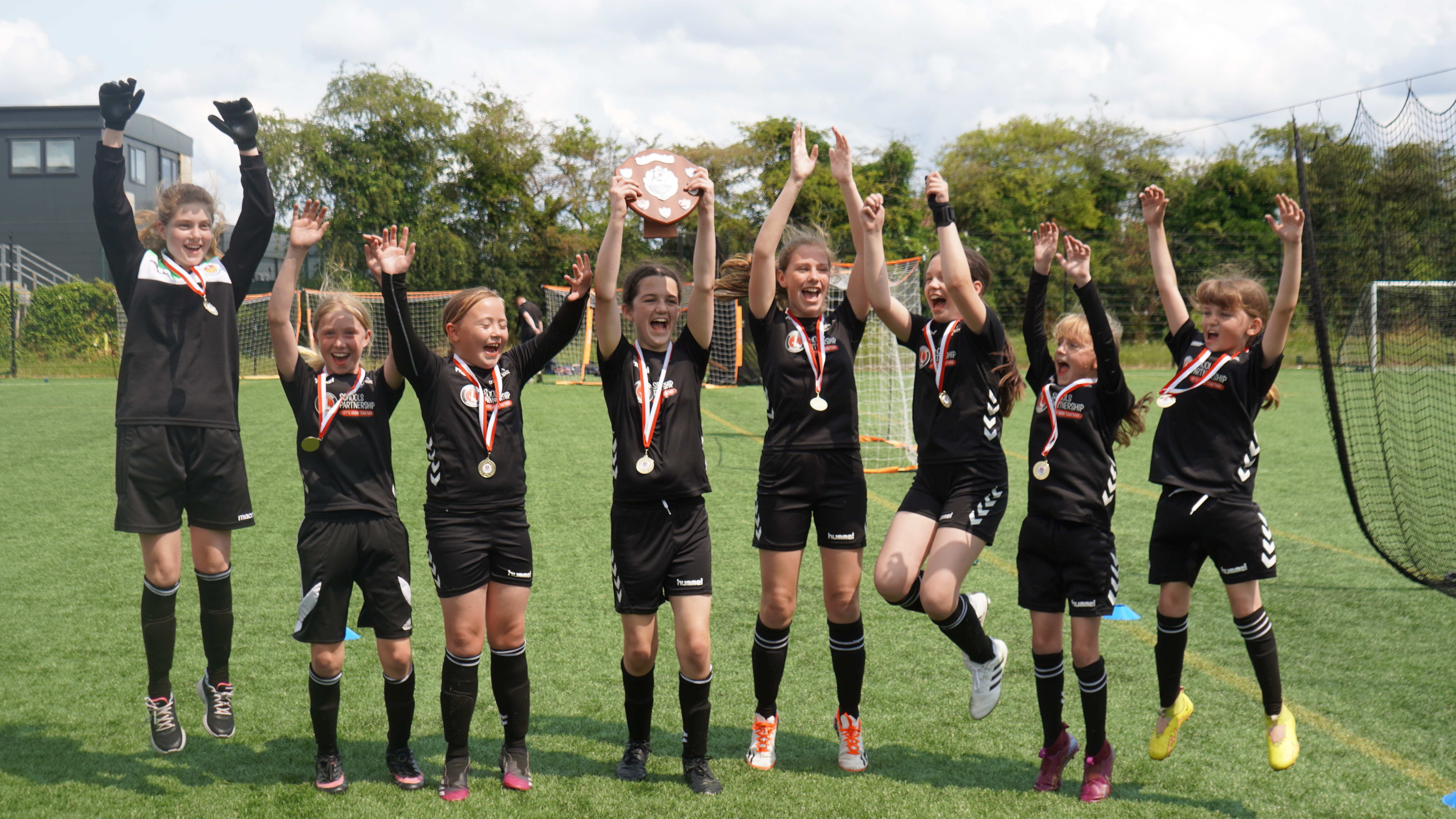 Girls celebrating winning a tournament