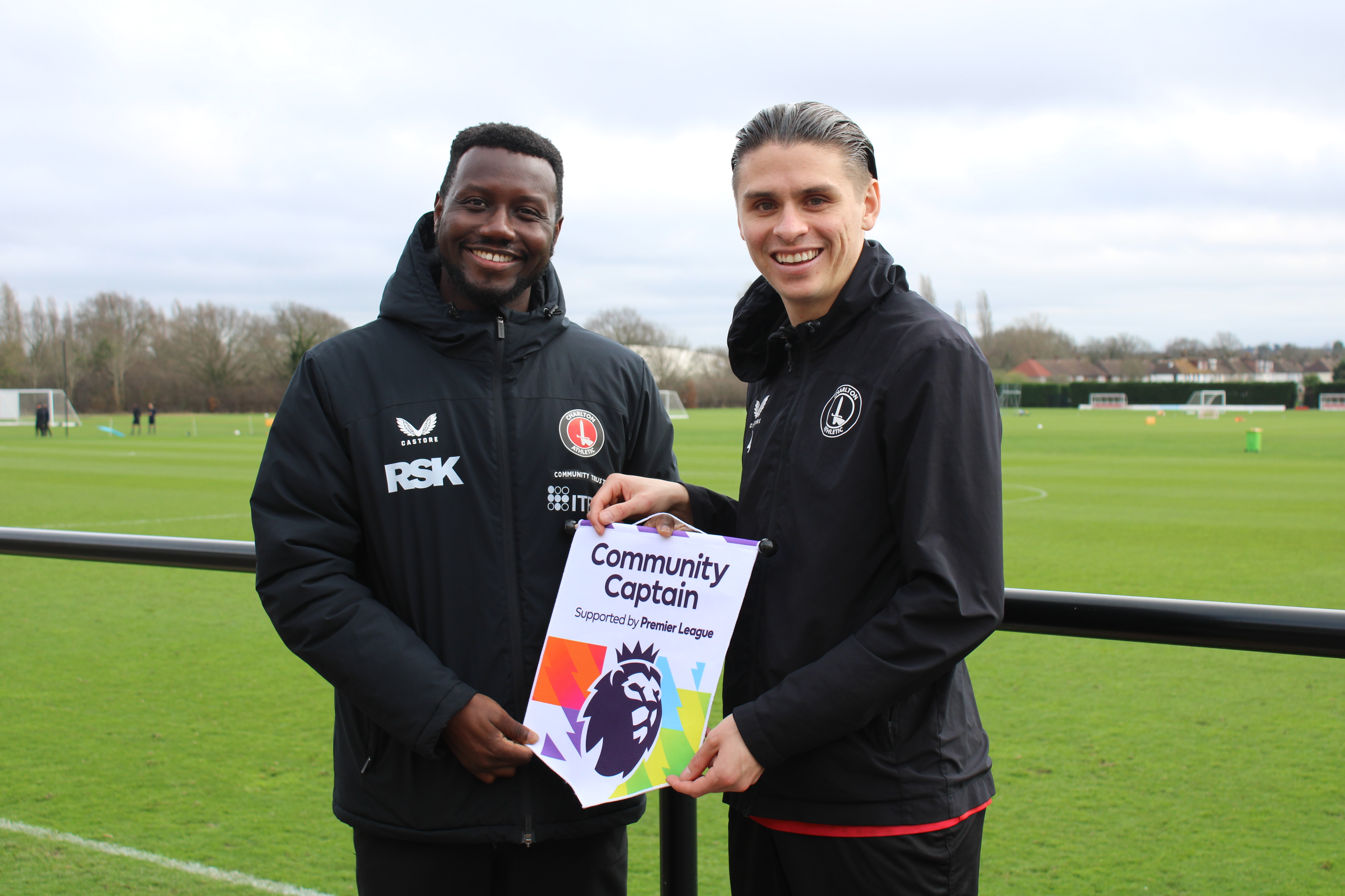 George Dobson presenting Anthony Quarm with a Premier League award