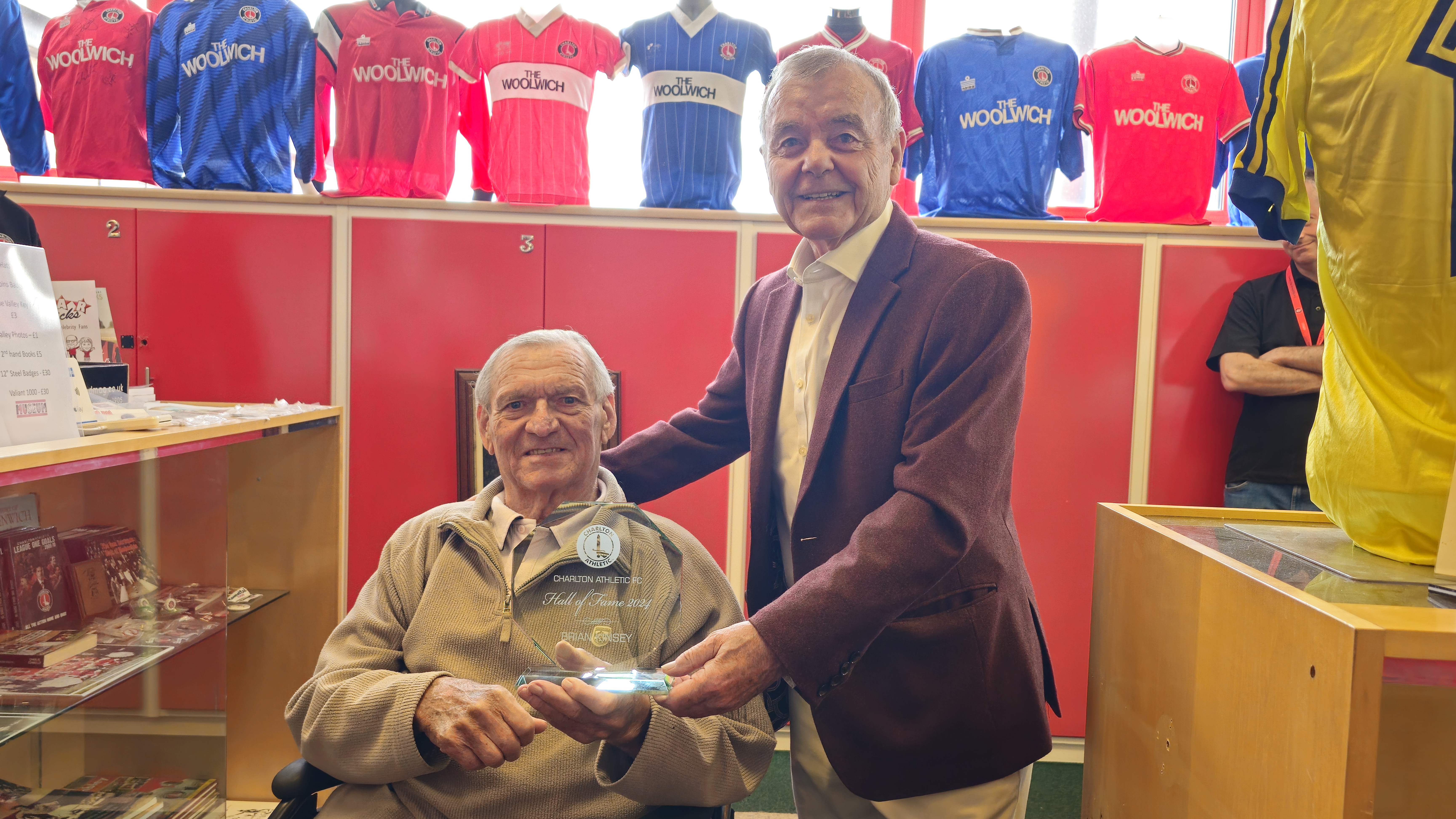 Keith Peacock presents Brian Kinsey with his Hall of Fame award at the Charlton Athletic Museum.
