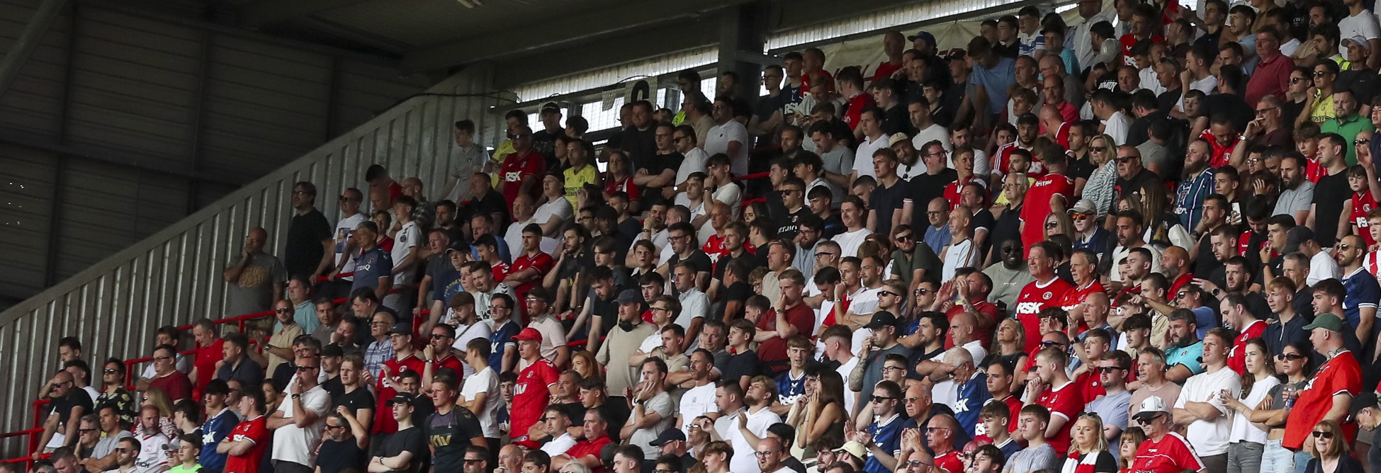 Fans in the Covered End watch on