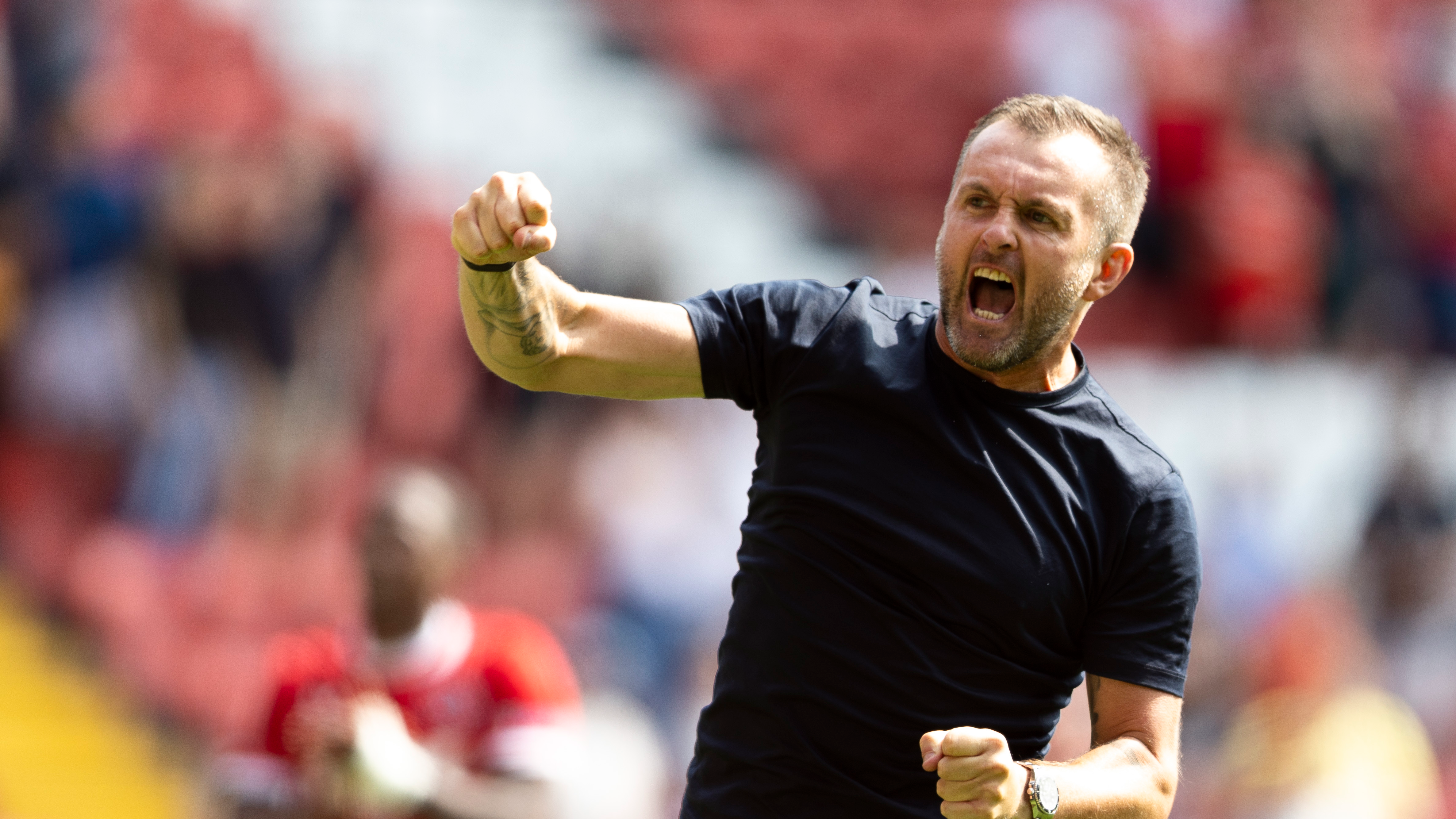 Nathan Jones celebrates after Leyton Orient victory.