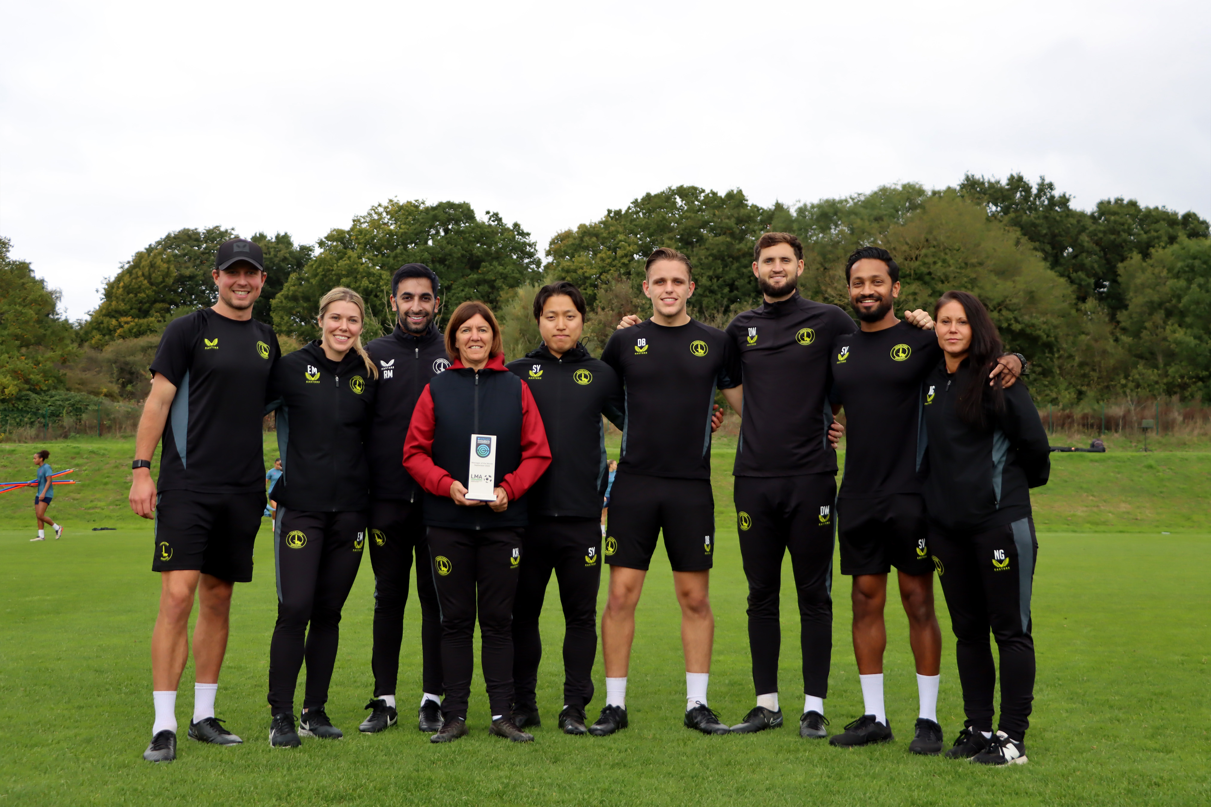 Karen and the squad with the MOTM trophy