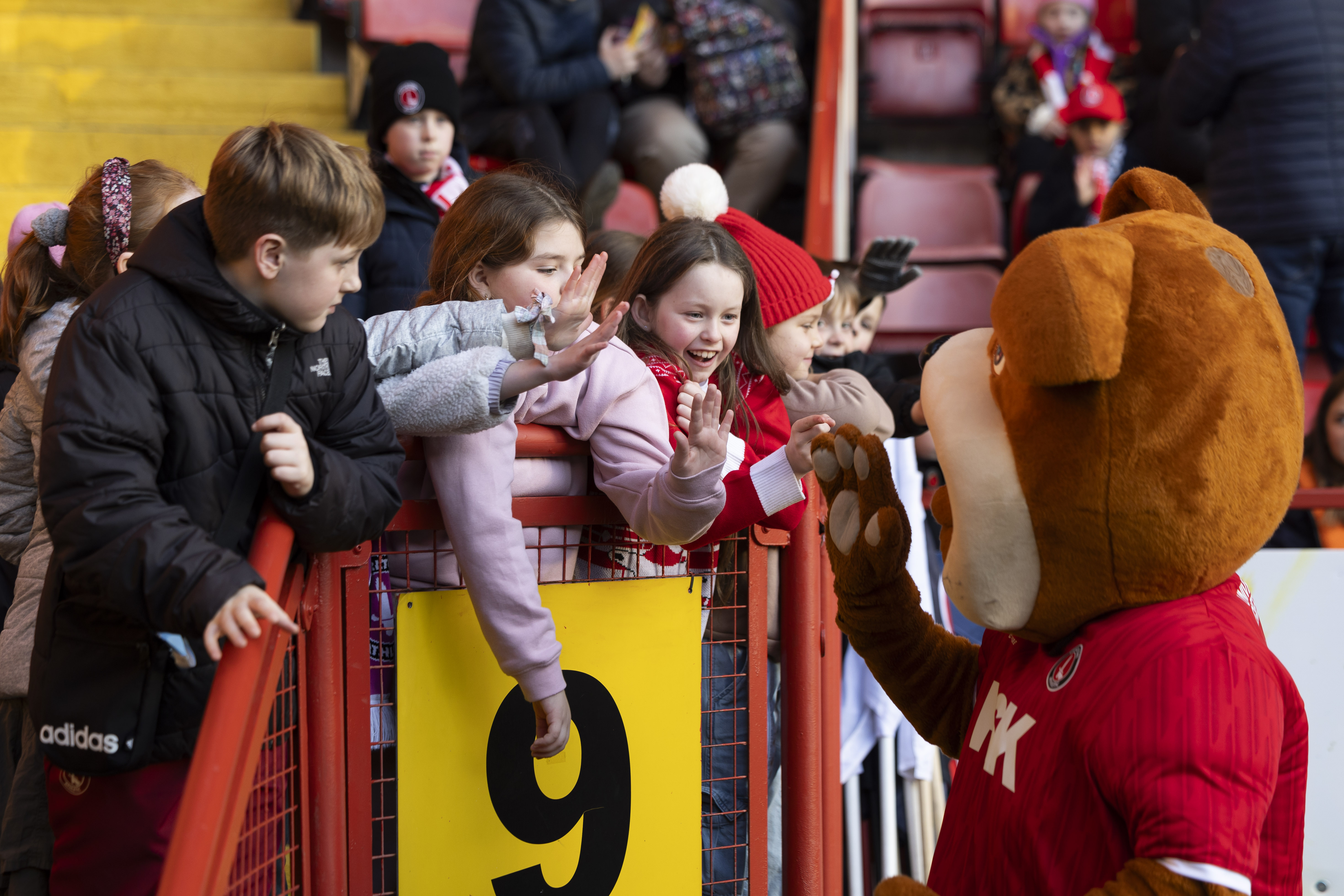 Charlton fans high five club mascot