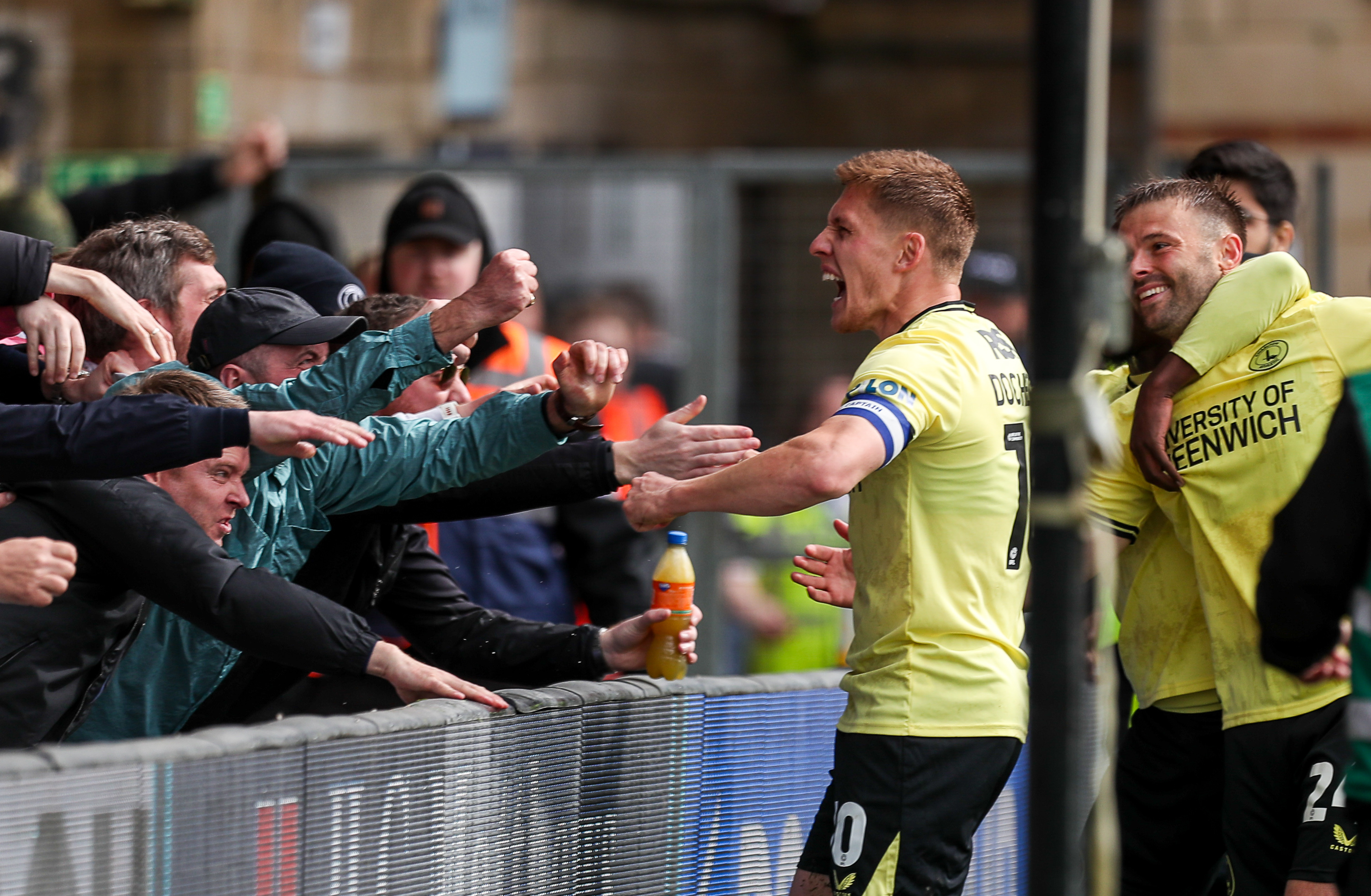 Greg Docherty celebrates with fans