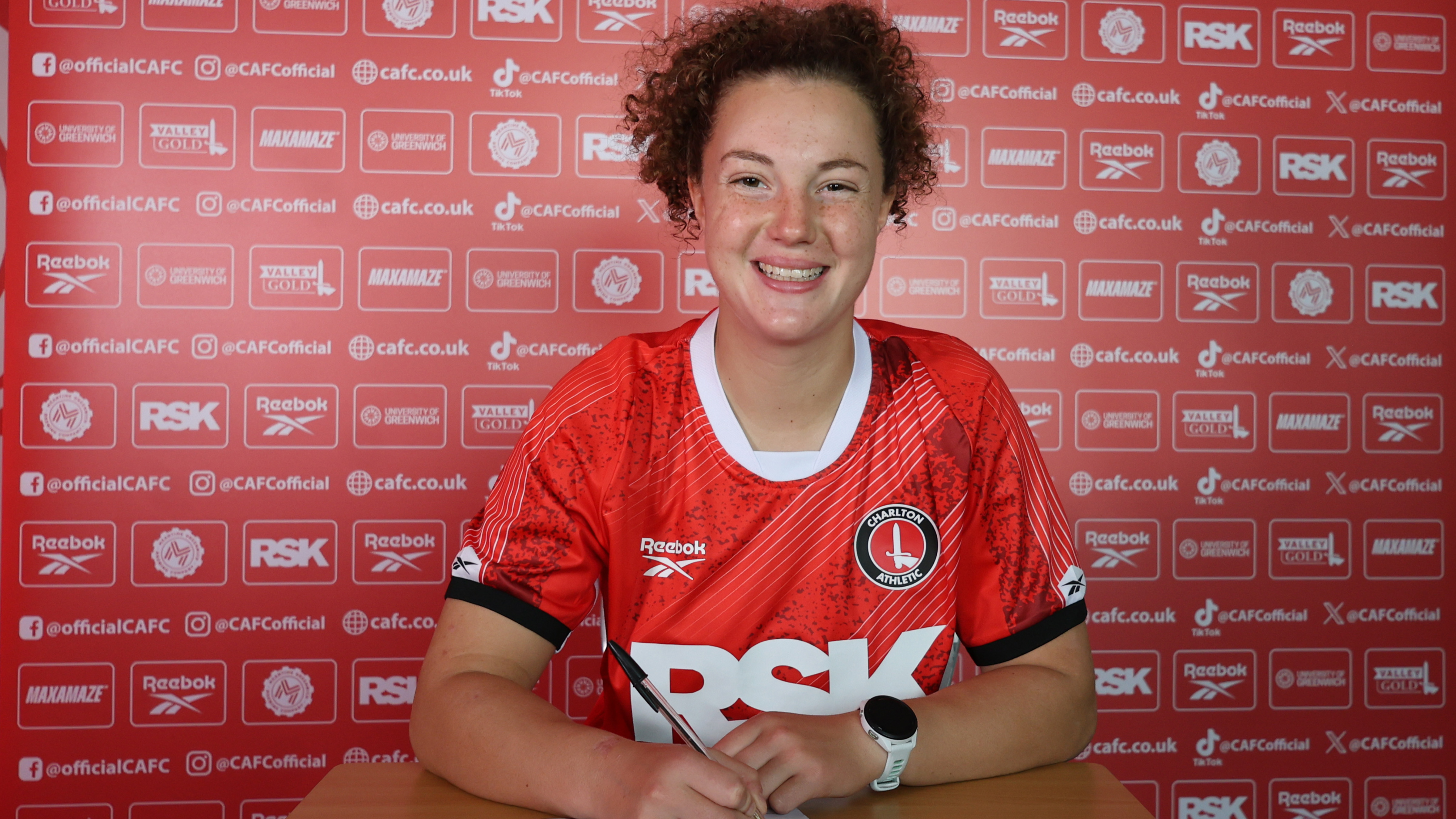 Mary signing