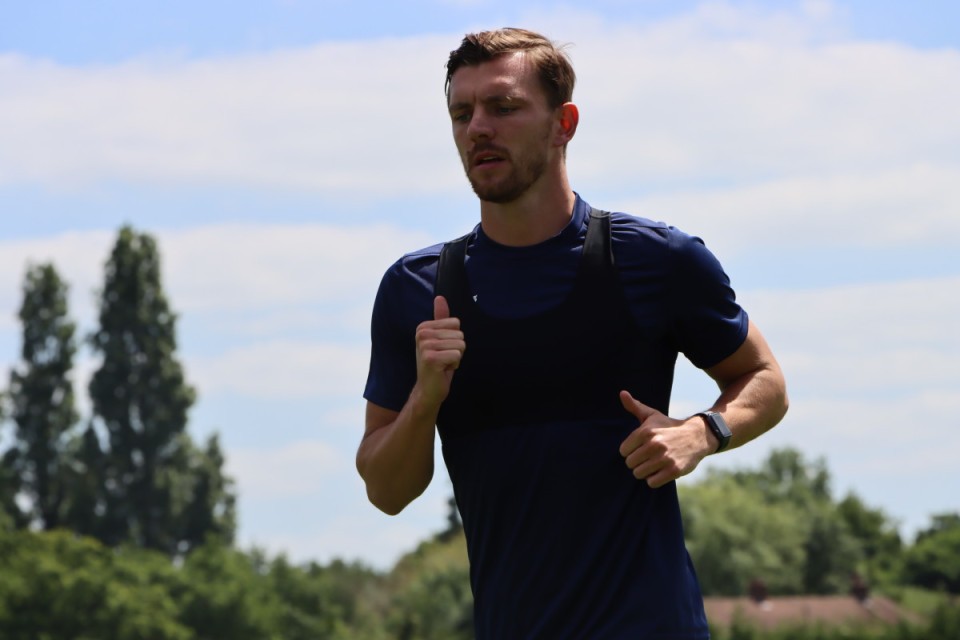 Alex Gilbey pictured running on the training pitches