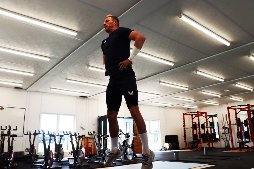 Craig MacGillivray jumps in the gym