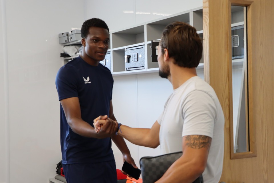 Deji Elerewe and Jake Forster-Caskey shake hands