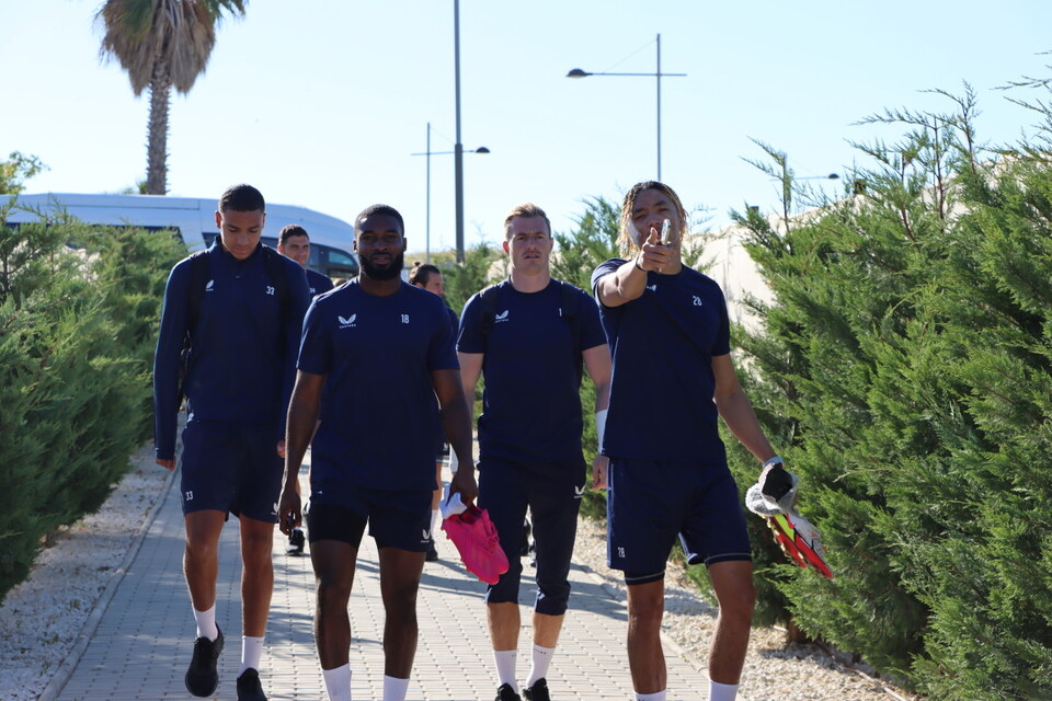 Sean Clare points to the camera as the Addicks squad return to their hotel