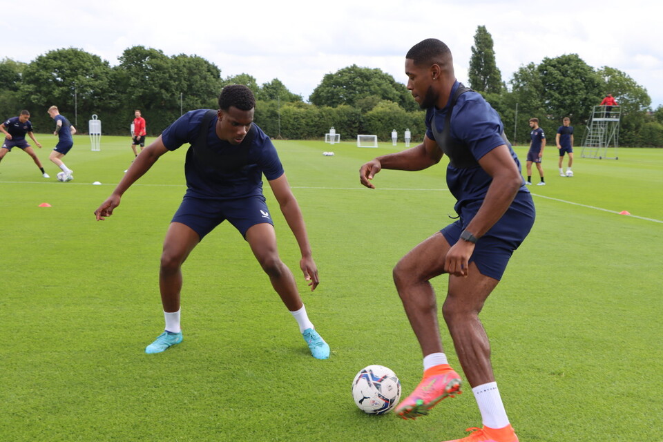 Deji Elerewe defends against Chuks Aneke