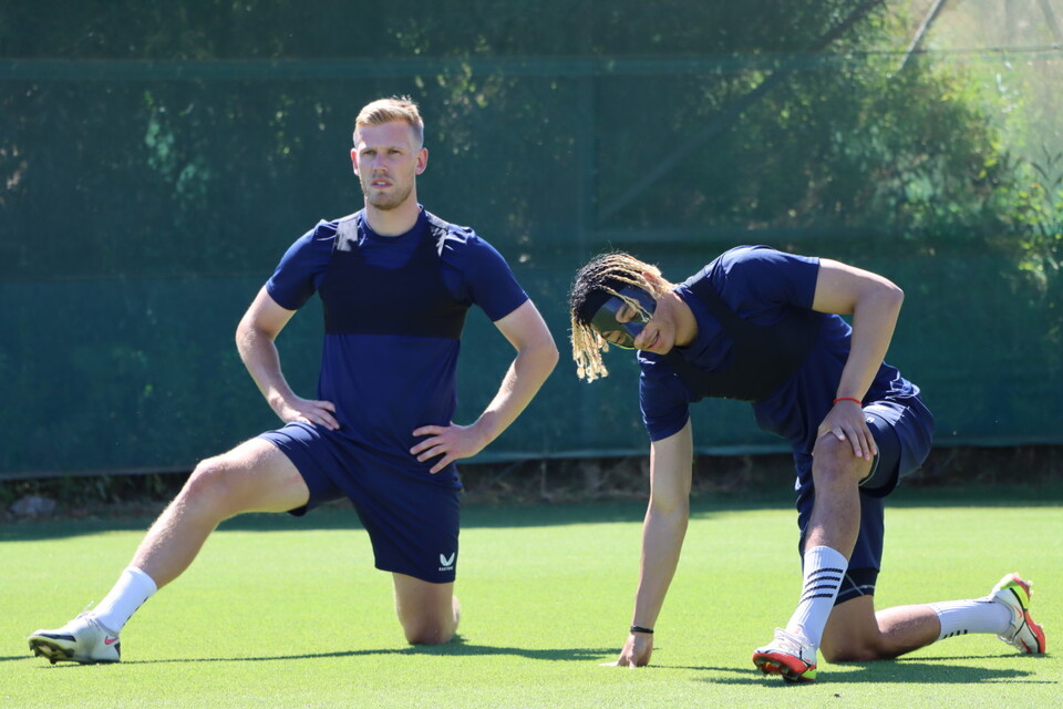 Jayden Stockley and Sean Clare stretch ahead of training