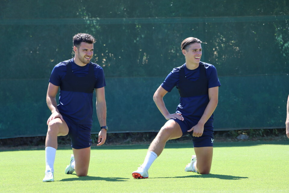 Scott Fraser and George Dobson stretch ahead of training
