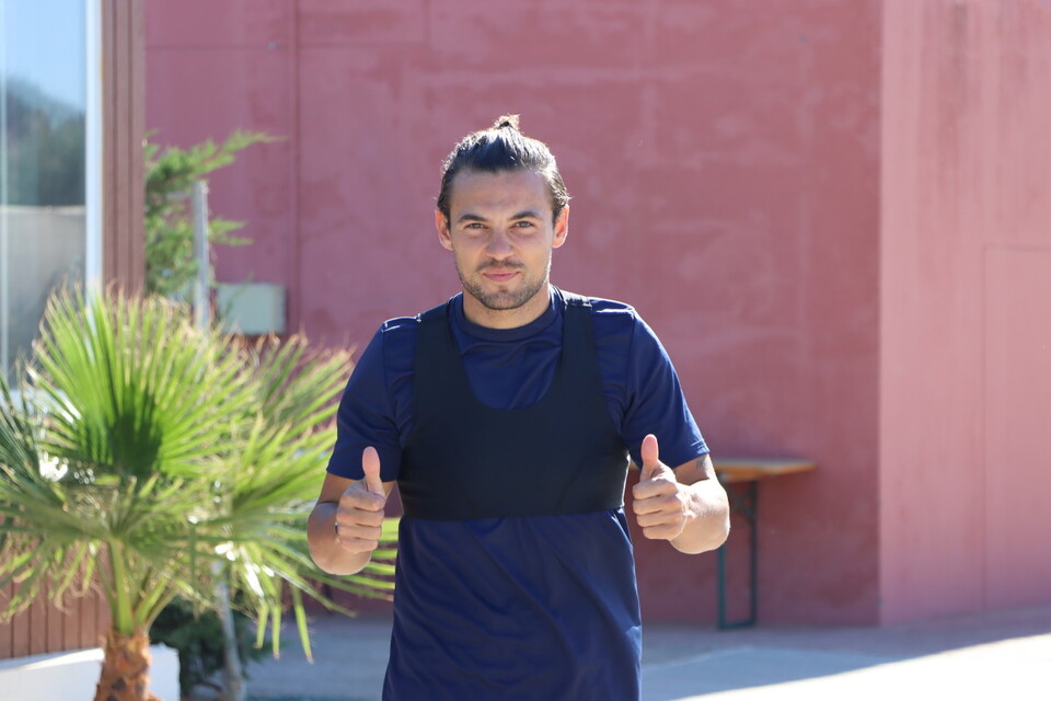 Jake Forster-Caskey puts both of his thumbs up to the camera