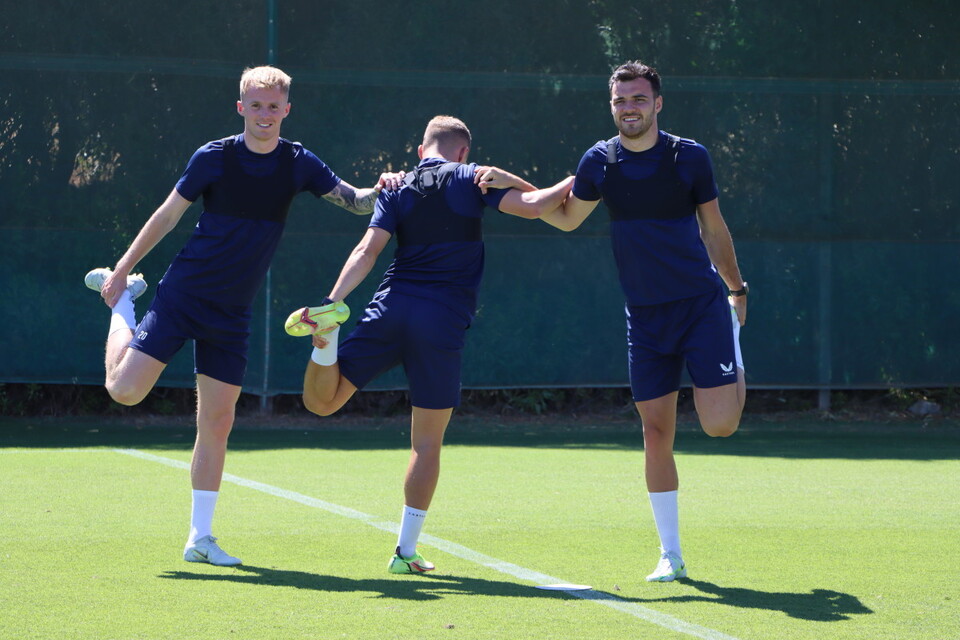 Charlie Kirk, Charles Clayden and Scott Fraser stretching