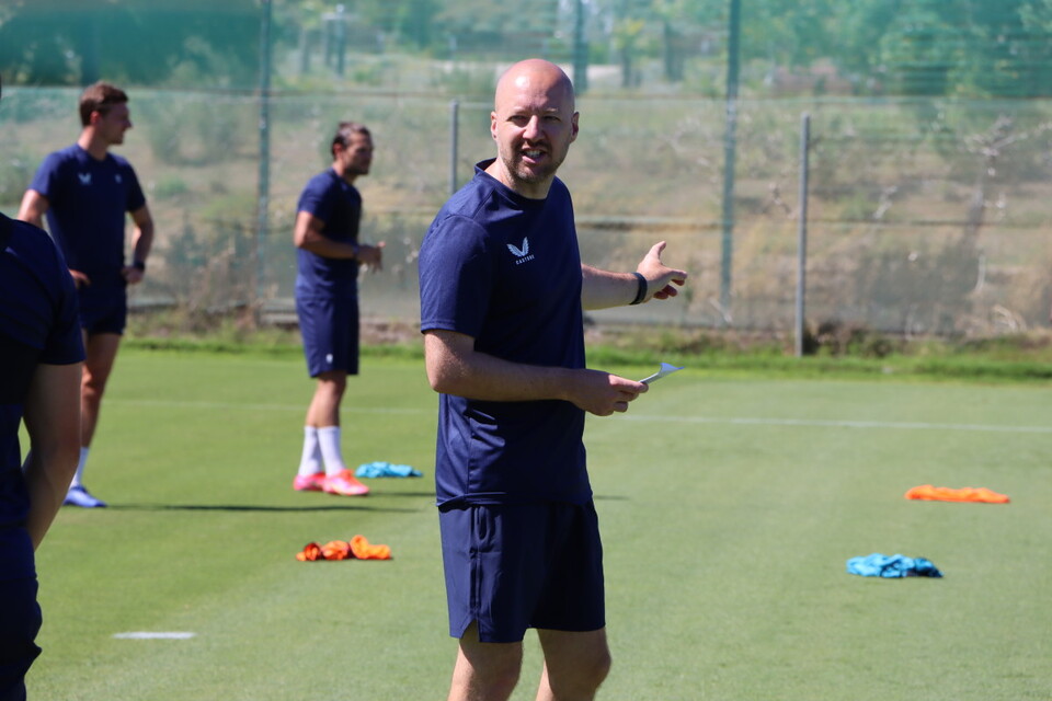 The gaffer delivers instructions with a piece of paper in his right hand