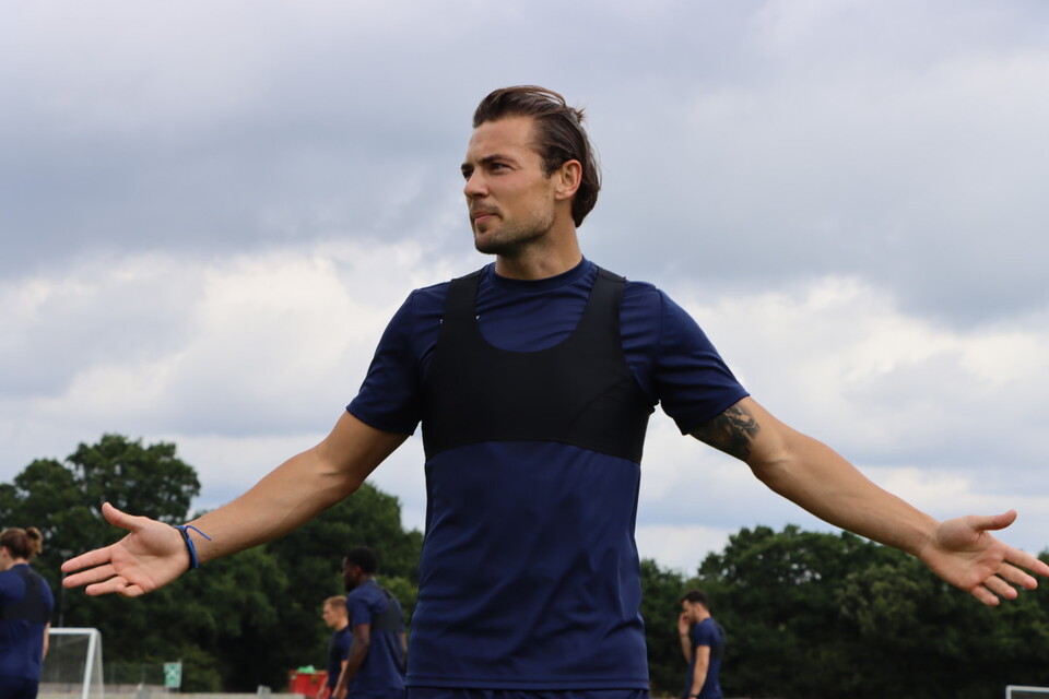 Jake Forster-Caskey pictured with his arms outstretched