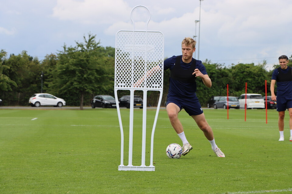 Jayden Stockley dribbles past a mannequin at Sparrows Lane