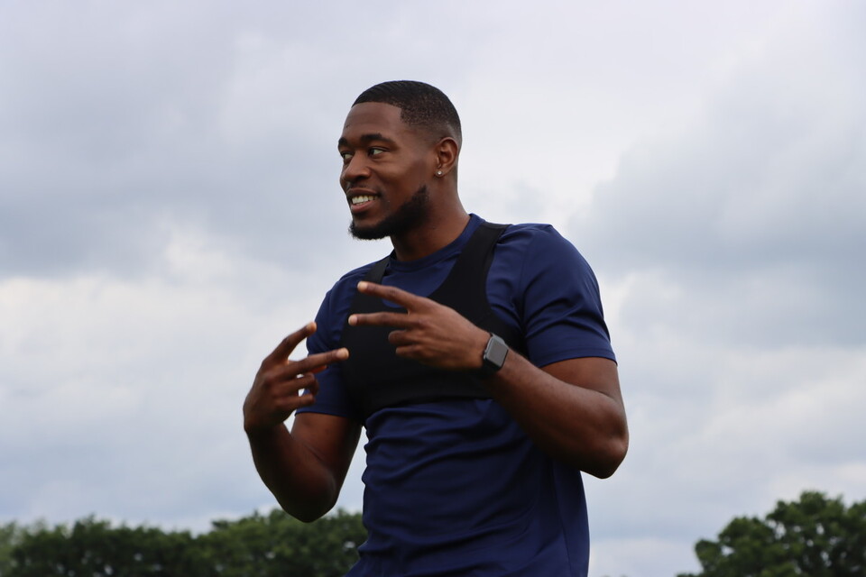 Chuks Aneke smiles during pre-season training