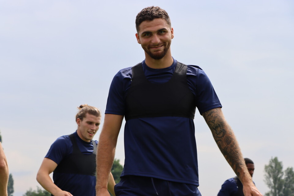 Ryan Inniss smiles down the camera lens