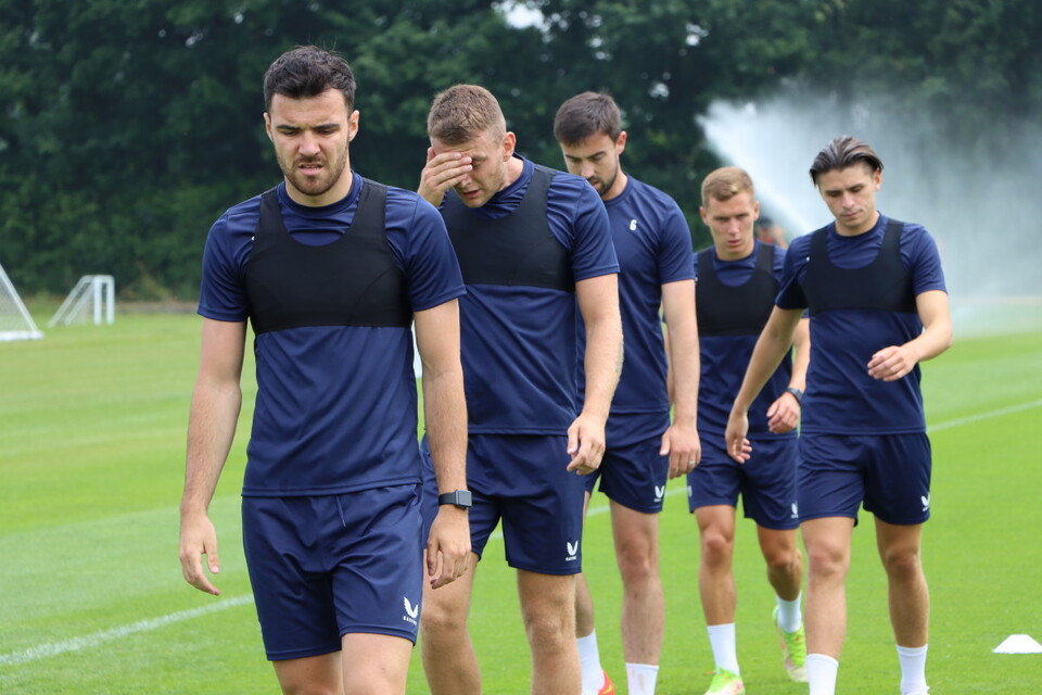 The Charlton squad walk back to the starting point of a drill