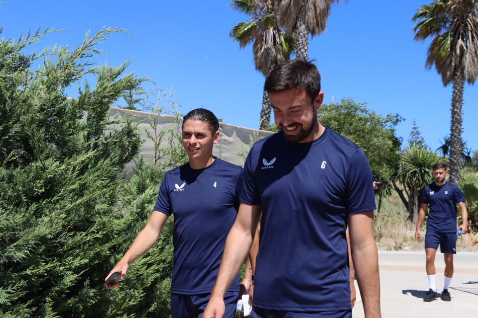 George Dobson and Eoghan O'Connell walking back to the team's hotel - with Aaron Henry in the distance