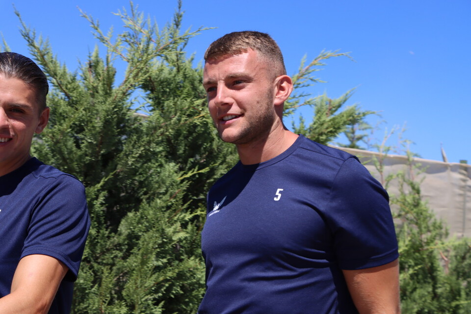 George Dobson and Sam Lavelle smile as they walk back to the team's hotel