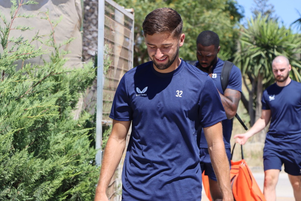 Aaron Henry smiles while walking back to the team's hotel