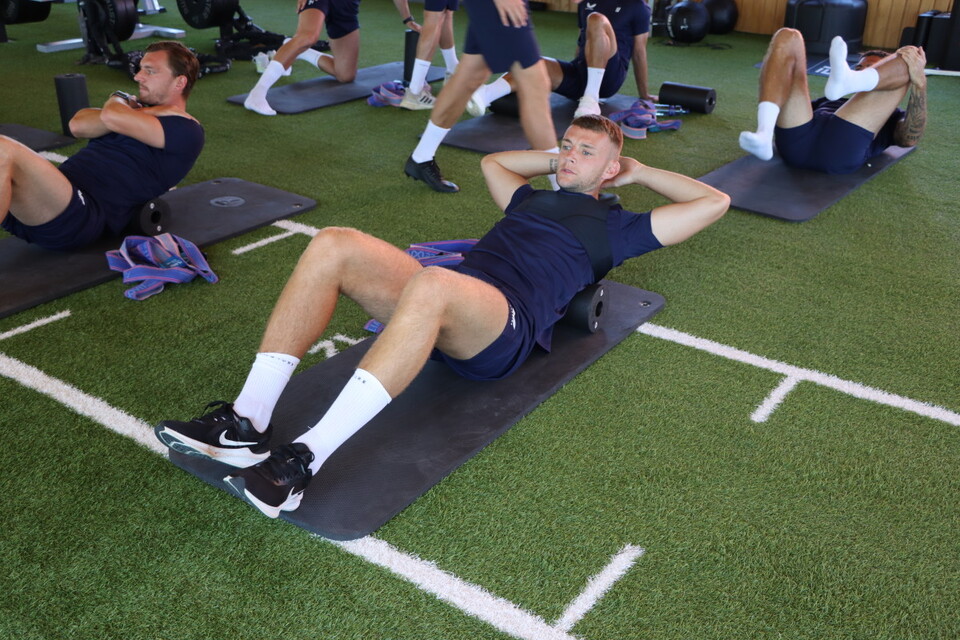 The Addicks squad using foam rollers in the gym