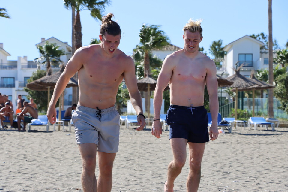 Josh Davison and Craig MacGillivray go for a dip in the sea