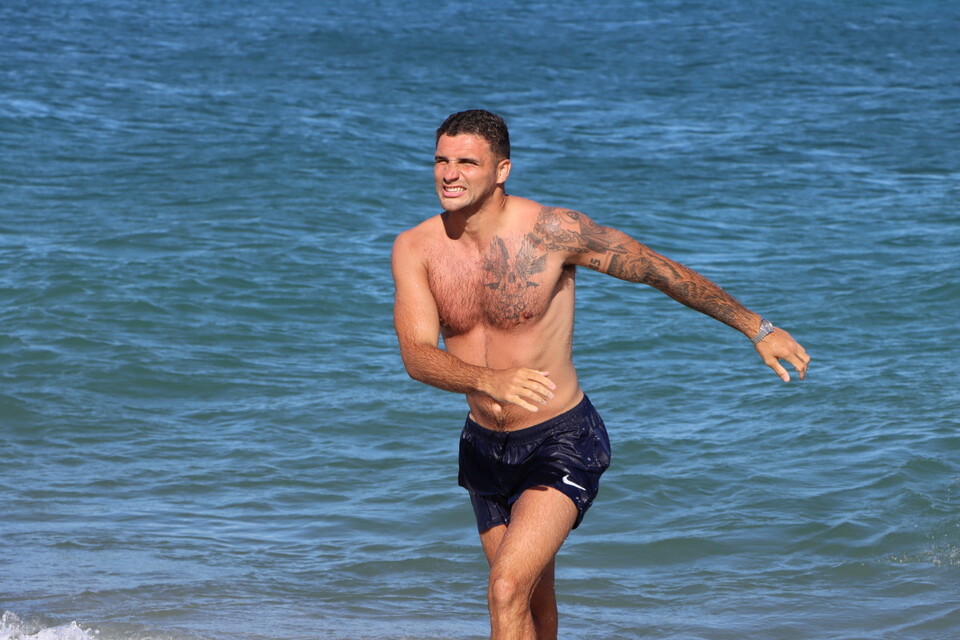 Ryan Inniss leaves the sea after a swim 