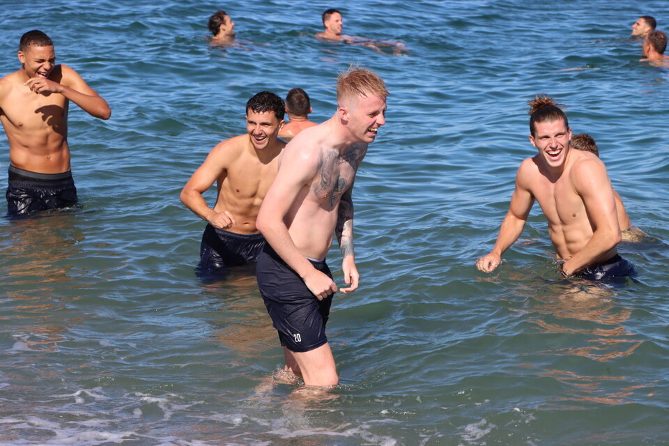 The Charlton squad take a dip in the Spanish sea