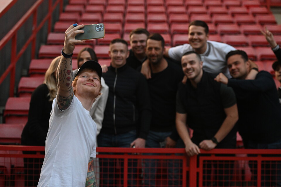 Ed Sheeran poses for pictures with Charlton fans