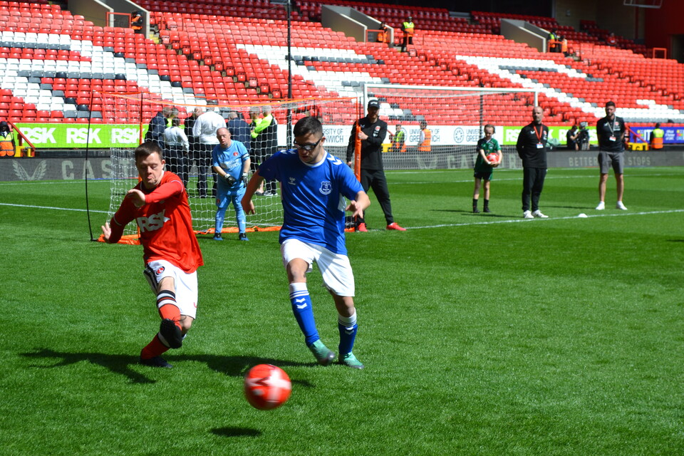 EITC and Upbeats playing football