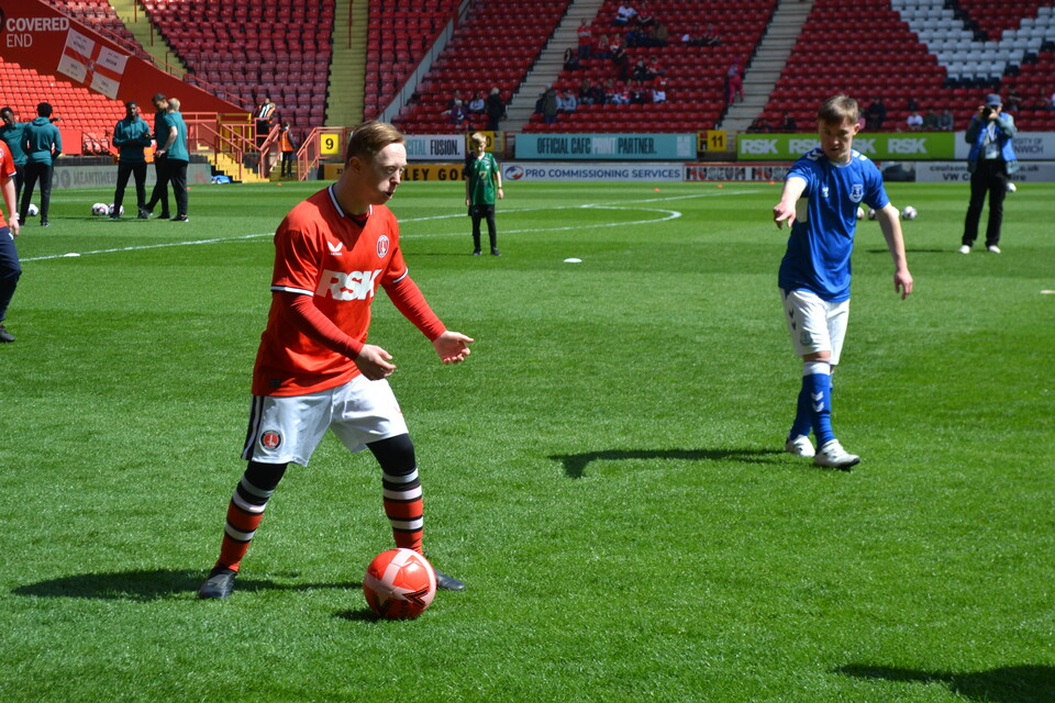 EITC and Upbeats playing football