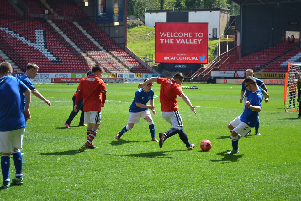 EITC and Upbeats playing football