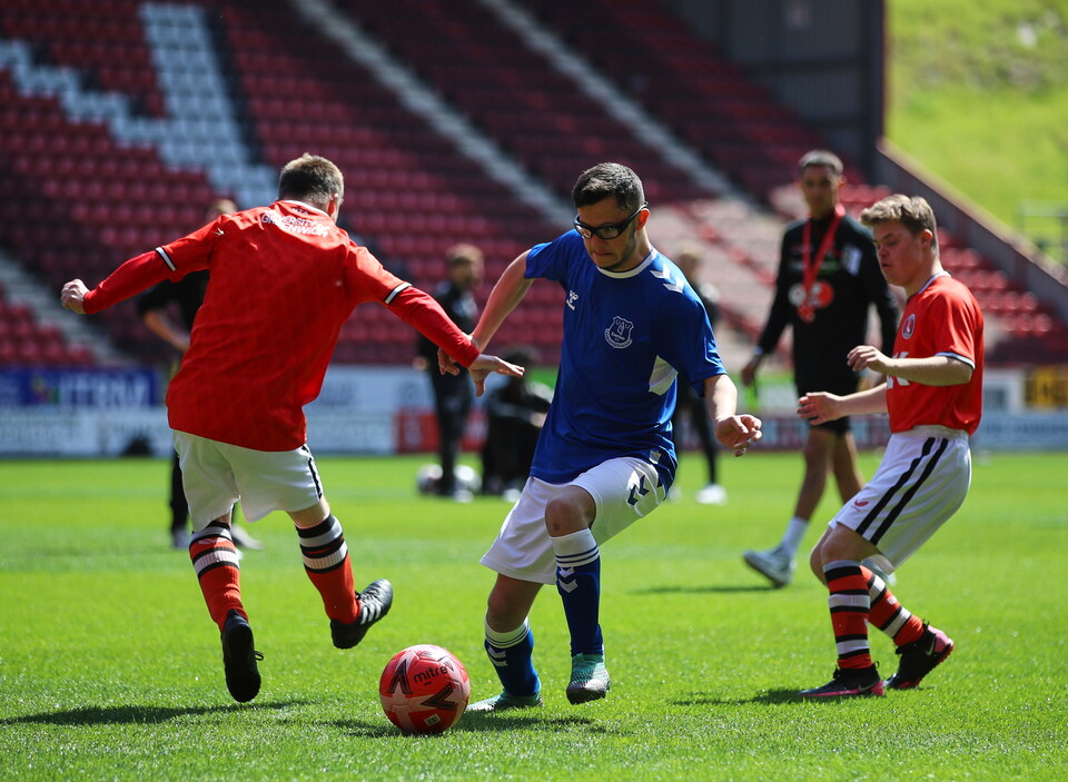 EITC and Upbeats playing football
