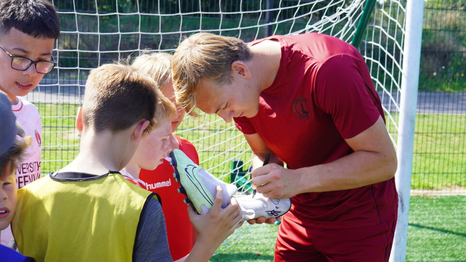 Ashley signing some boots