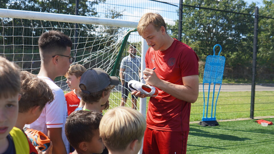 Ashley signing some boots