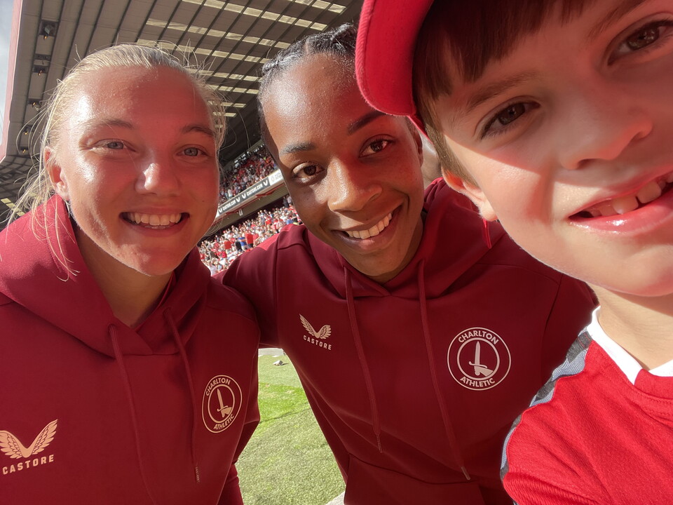 Captain Kiera Skeels and Forward Melissa Johnson with young fan