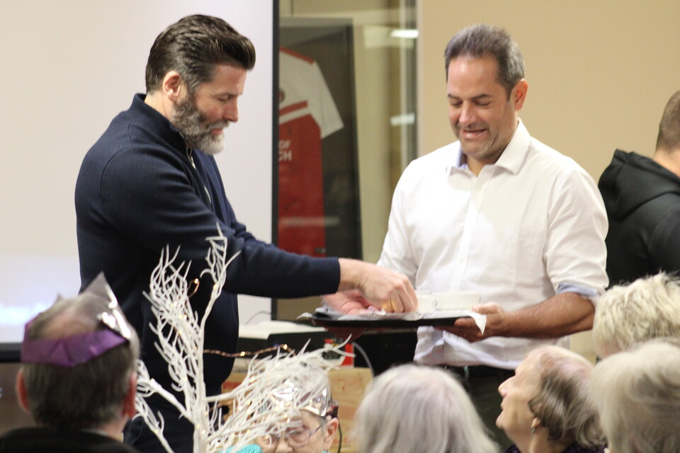 James Rodwell and Charlie Methven serving Christmas dinner