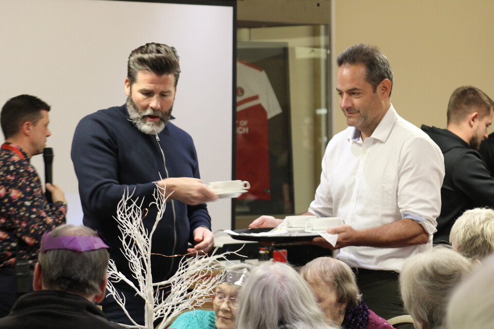 James Rodwell and Charlie Methven serving Christmas dinner