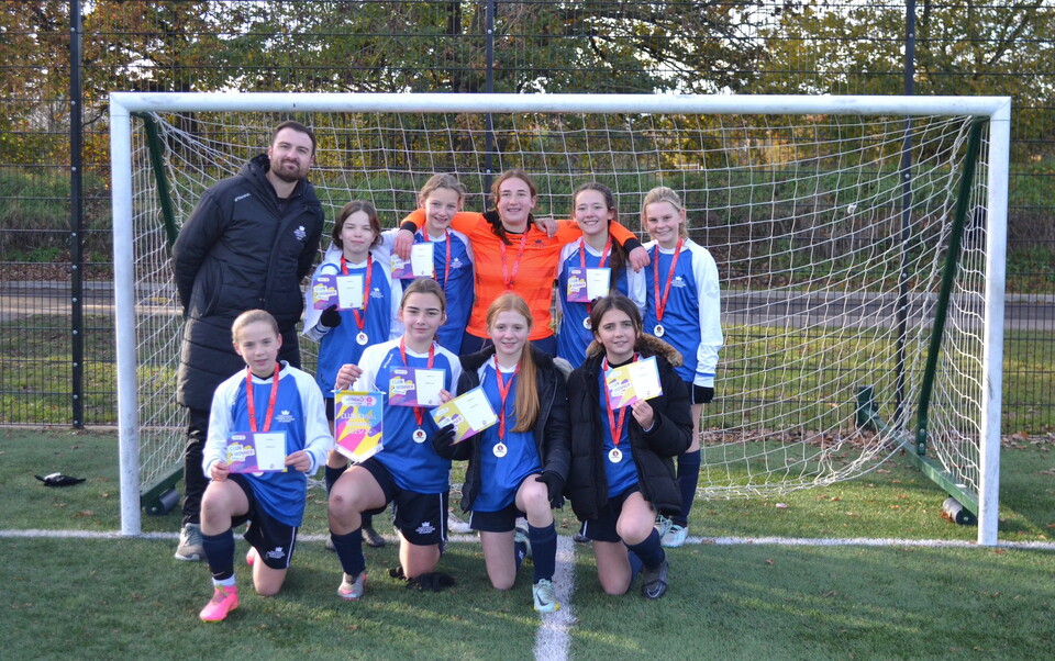 Group photo of Crown Woods Secondary School after winning the EFL Girls Cup tournament