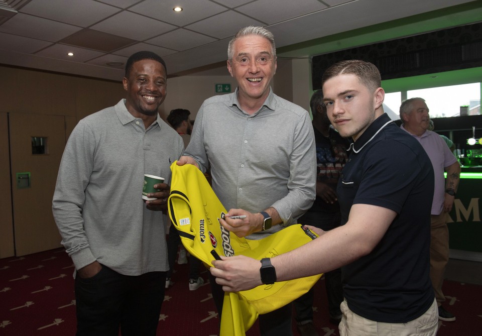 Kevin Lisbie watches as Dean Kiely sings a shirt during a Charlton Legends Q&A in the Meantime Fans’ Bar at The Valley, London