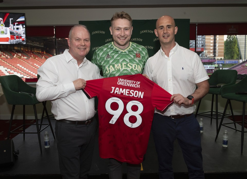 Charlton Athletic Commercial Manager Steve Sutherland (left) and Charlton Athletic Head of Sales Barry Higson hold a signed Charlton Athletic shirt with Jameson Head of Branding Kevin O'Neil during a Charlton Legends Q&A in the Meantime Fans’ Bar at The Valley, London