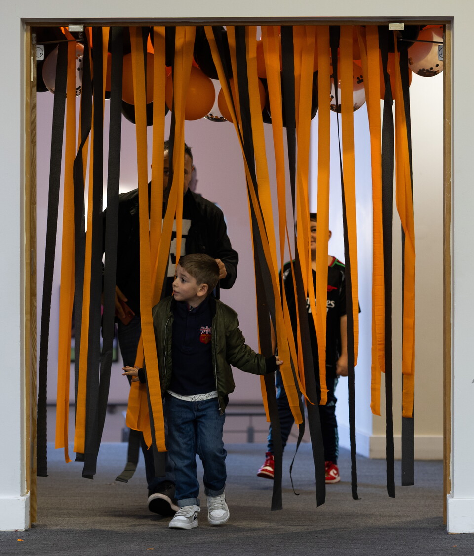 Young supporter on entrance to the Halloween Party