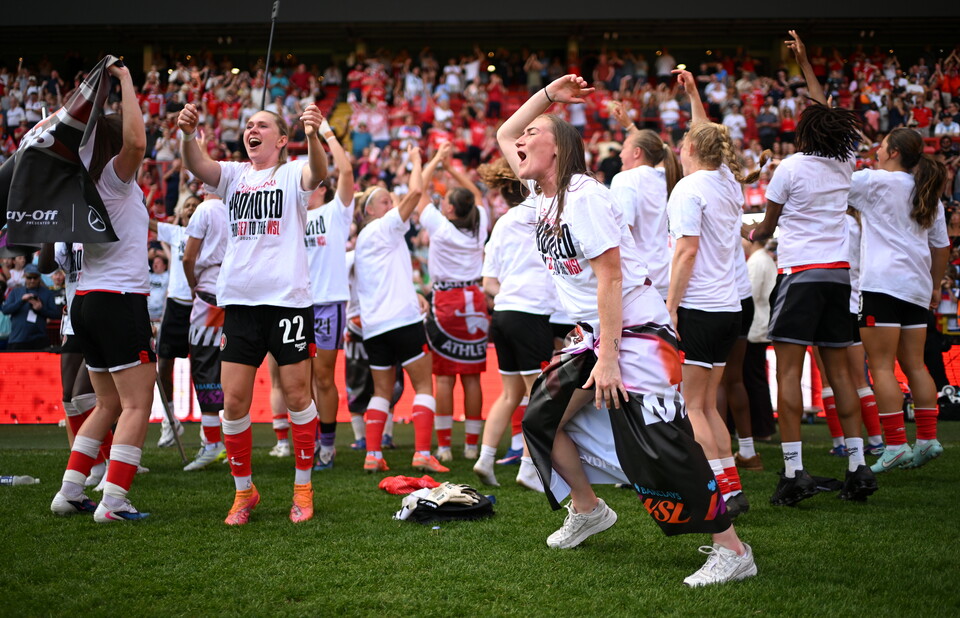 Players celebrating in front of fans
