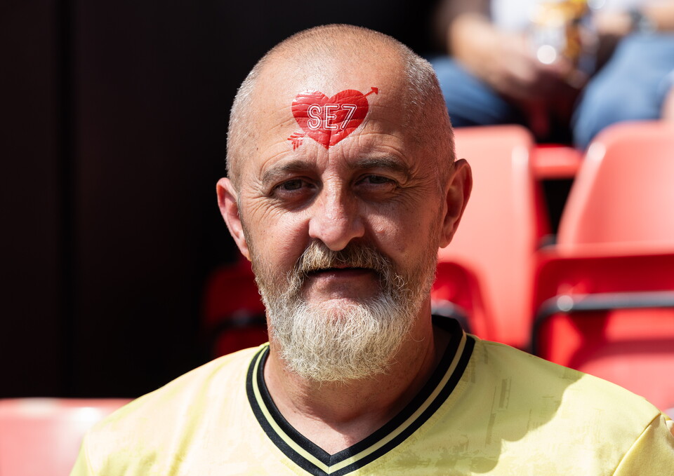 Fan with tattoo on forehead